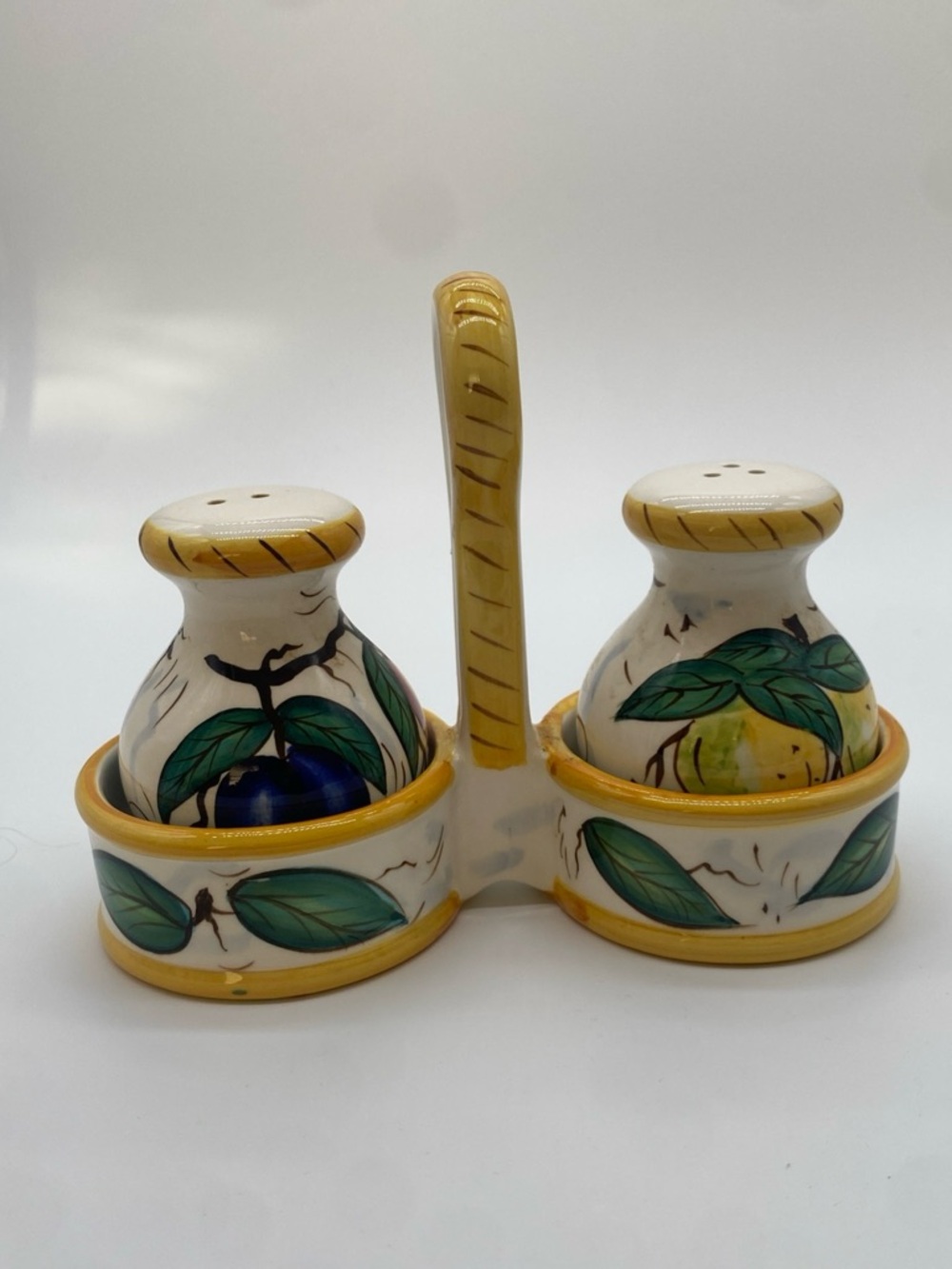 Salt and pepper shakers with caddie